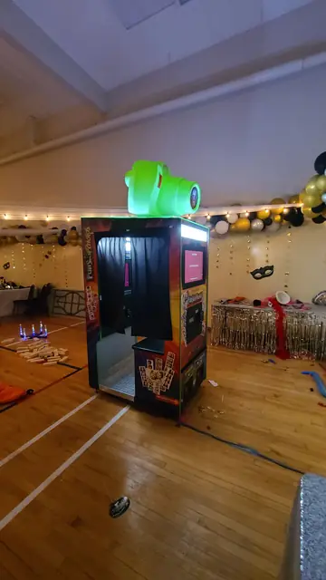 Photo booth in a gym decorated with balloons, June 2024