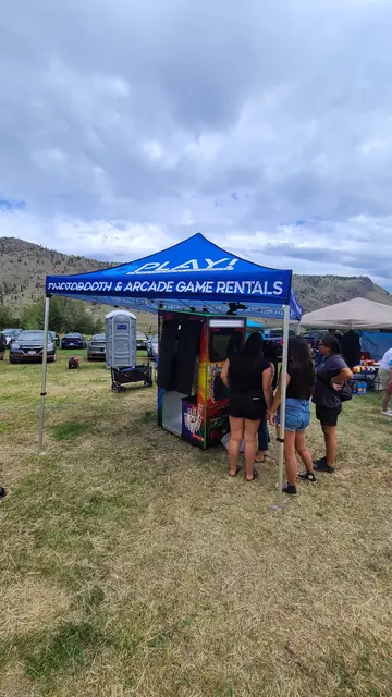 Photo booth under a canopy at an outdoor event, June 2024