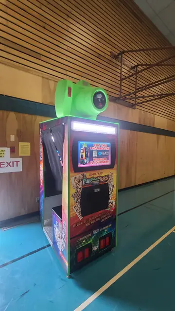 Photo booth set up in a gym, August 2024