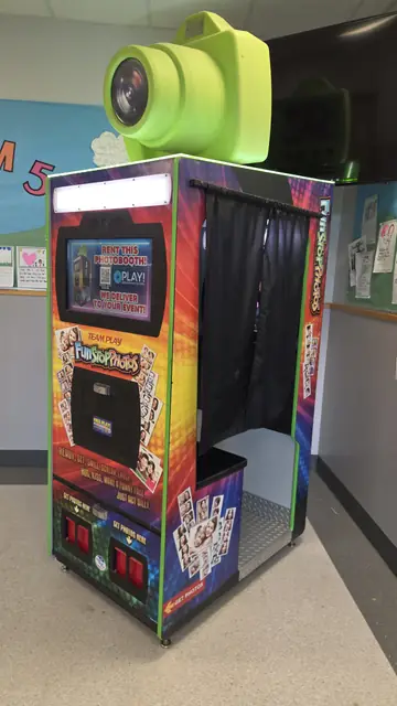 Photo booth set up against a colourful mural wall, May 2026