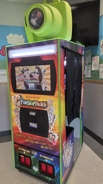 Photo booth with its lime camera topper, May 2026